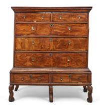 An English walnut and oak feather banded chest on stand, first quarter 18th century and later, tw...