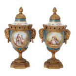 A pair of gilt-bronze mounted Sevres style vases and covers, third quarter 19th century, the bodi...