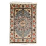A Turkish silk Kayseri rug, last quarter 20th century, the central floral medallion surrounded by...