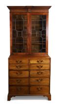 A George III mahogany secretaire bookcase, last quarter 18th century, the stepped and dentil moul...