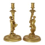 A pair of French gilt-bronze figural candlesticks, in the manner of Corneille van Clève (1646-173...
