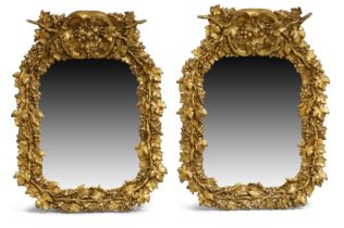 A pair of English parcel silvered and gilt composite mirrors, second quarter 19th century, each l...