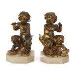 A pair of French gilt-bronze models of Bacchic fauns, in the manner of Clodion, the figures possi...