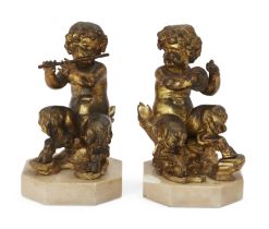 A pair of French gilt-bronze models of Bacchic fauns, in the manner of Clodion, the figures possi...