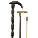 A white-metal mounted whale bone swagger stick, late 19th century, 68cm long; together with a buf...