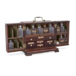 A George III mahogany apothecary chest, c.1800, with brass carrying handle, the double doors open...