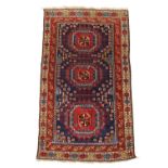 A Caucasian Dagestan rug, first quarter 20th century, the central field with three geometric meda...