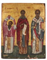 A Greek icon of Three Saints, early 20th century, the saints portrayed frontally full-length with...