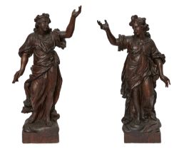 A pair of North European oak models of angels, 18th century, each depicted contrapposto, with one...