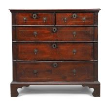 A George I inlaid oak chest, first quarter 18th century, walnut crossbanded, two short and three ...