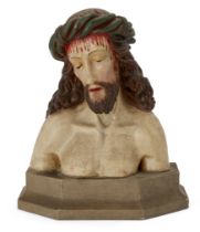 A polychrome plaster bust of Christ as the 'Man of Sorrows', 20th century, wearing a crown of tho...