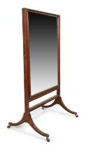 A George III mahogany cheval mirror, last quarter 18th century, the rectangular plate in reeded f...