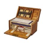 An Edwardian walnut playing card compendium, by Charles Goodall, c.1910, the hinged lid and fall-...