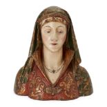 An Italian polychrome and parcel-gilt wood bust of a female saint, 18th century, modelled with gr...