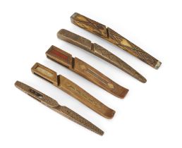 Five treen knitting sheaths, early 19th century, comprising: a chip-carved example with 'bird-cag...