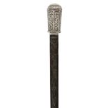 A white metal mounted ebony walking cane, Spanish or Portuguese, late 19th century, the white met...