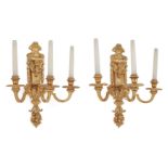 A pair of English gilt-bronze three-light wall appliques, first quarter 20th century, the backpla...