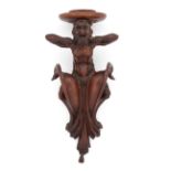 An Italian walnut wall bracket, late 19th century, modelled as a fawn with expressive face, 51cm ...