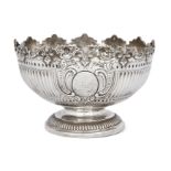 A Victorian silver punch bowl, London, 1881, Robert Harper, the shaped shell and scroll border to...
