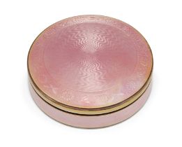A continental pink guilloche enamelled box, stamped 925, of circular form with decorative floral ...