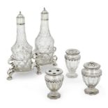 A George II silver cruet stand, London, 1729, Samuel Welder, with two associated silver capped cr...