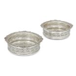 A pair of George III silver coasters, London, 1812, Solomon Hougham, with shell and foliate decor...