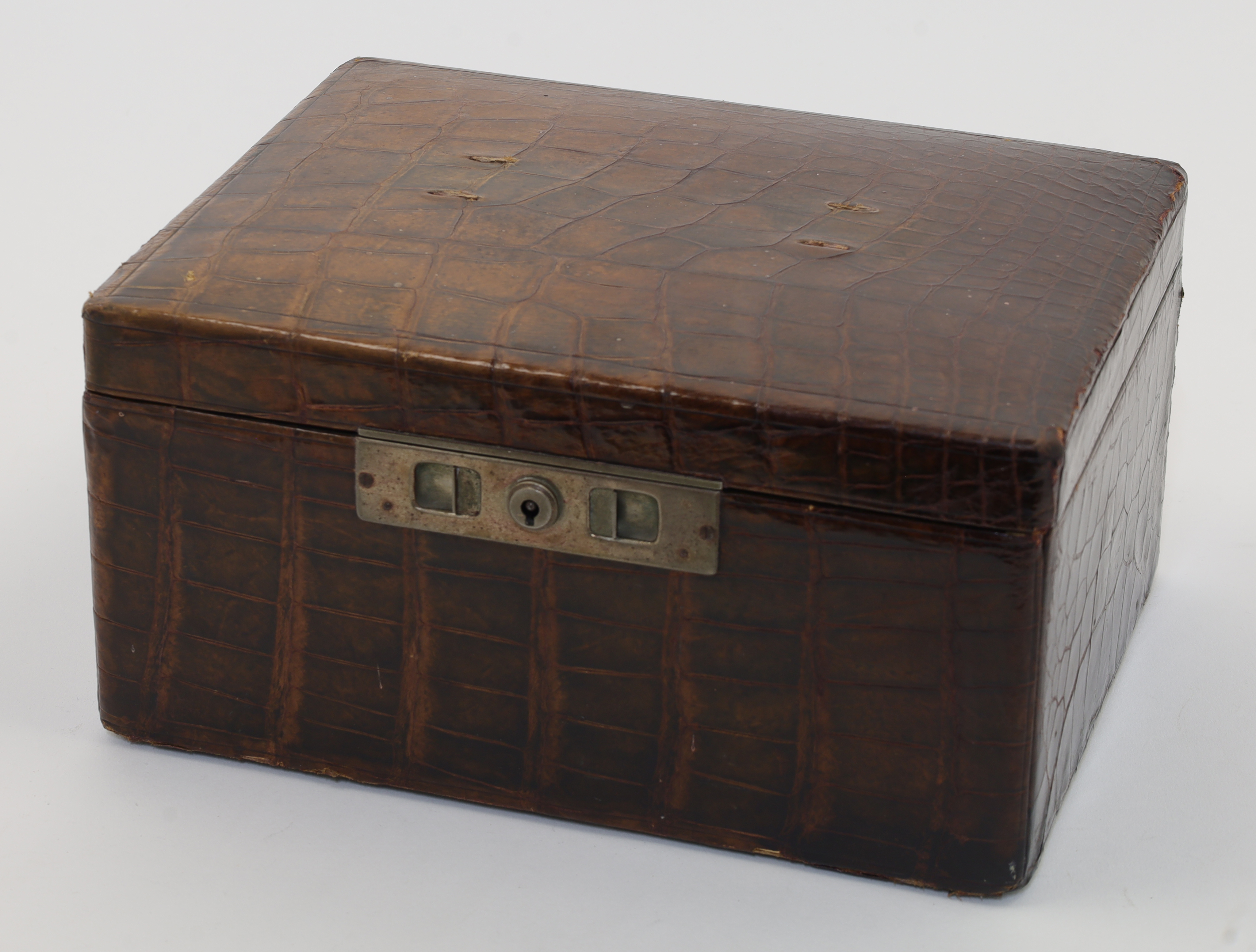 A crocodile skin travelling vanity case, enclosing a partially fitted interior with five silver t... - Image 2 of 2