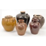 Five large Chinese black, brown and amber glazed stoneware ewers, 20th century one with matching ...