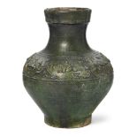 A Chinese lead green-glazed moulded vase, Han dynasty, moulded around the shoulder with a border ...