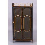 A Victorian bamboo side cabinet, last quarter 19th century, with gallery top and painted canvas f...