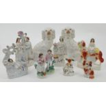 A group of Staffordshire figures and figure groups, 19th century, comprising: a pair of seated Ki...