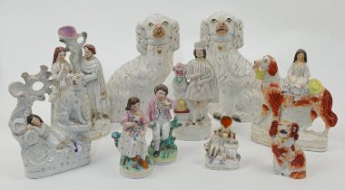 A group of Staffordshire figures and figure groups, 19th century, comprising: a pair of seated Ki...