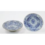 A Laterza maiolica blue and white footed bowl, 18th century, the centre painted with a bird in a ...