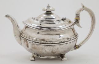 A George III silver teapot, London, 1818, maker I B, of squat oval form, with reeded banding to b...