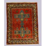 A Turkish Kazak carpet, third quarter 20th century, the central field with mirrored medallion sur...