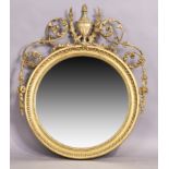 A Victorian giltwood and composite convex mirror, last quarter 19th century, the moulded circular...