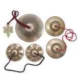 Two pairs of Tibetan bronze cymbals and a hanging bell, tingsha, 19th - 20th century, comprising:...