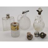 A small group of Victorian silver mounted bottles and objects, comprising: a silver mounted glass...