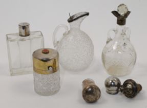 A small group of Victorian silver mounted bottles and objects, comprising: a silver mounted glass...