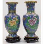 A pair of Chinese cloisonné enamel vases, 20th century, each decorated with birds hovering above ...