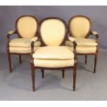 A set of three French mahogany fauteuils, in the Louis XVI style , third quarter 19th century, th...