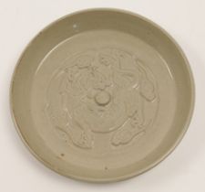 A Chinese moulded kui dragon plate, 20th century, the circular dish with a raised knob to the cen...