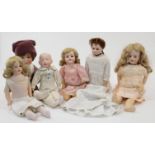 A selection of bisque headed dolls, to include: a bisque shoulder head doll on kid body with brow...
