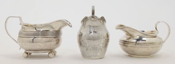 Three Georgian silver cream jugs, comprising: one example, London, 1799, possibly John Merry (mak...