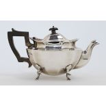 An Edwardian silver tea pot, London, 1908, Goldsmiths & Silversmiths Co Ltd, with ebonised handle...