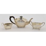 A two-piece silver tea set, comprising a teapot and a cream jug, Birmingham, 1919, Henry Matthews...