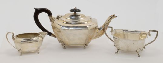 A two-piece silver tea set, comprising a teapot and a cream jug, Birmingham, 1919, Henry Matthews...