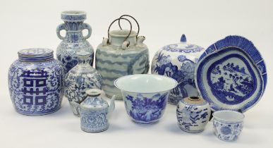 A group of Chinese blue and white vessels, 20th century, comprising two jars and covers, 20cm and...