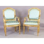 A pair of French giltwood armchairs, Louis XVI style, 20th century, the moulded frame with sky bl...