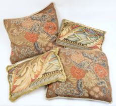 Four embroidered cushions, 19th century, each with decorative foliage motifs, the largest approx....